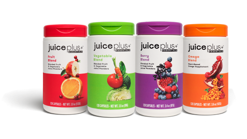 four canisters of Juice Plus capsules with purple, red, green, orange labels