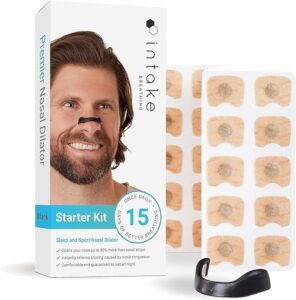 Product packaging with a man wearing Intake brand nasal dilator strip and smiling, actual product next to box.
