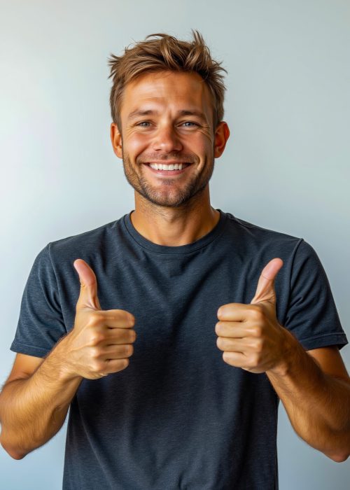 Man giving two thumbs up with smile